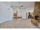 Open living room with a stone fireplace and tile floors at 2731 E Laurel Ln, Phoenix, AZ 85028