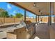 Outdoor kitchen with grill, sink, and ample counter space at 2731 E Laurel Ln, Phoenix, AZ 85028