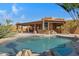 Inviting kidney-shaped pool with a large patio and outdoor kitchen at 2731 E Laurel Ln, Phoenix, AZ 85028