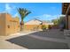 Landscaped side yard with gravel, plants, and storage shed at 2731 E Laurel Ln, Phoenix, AZ 85028