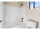 Bathroom with a white bathtub, shower and commode at 2742 N Augustine --, Mesa, AZ 85207