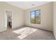 Bedroom featuring carpet, neutral walls, and a large window at 2742 N Augustine --, Mesa, AZ 85207