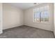 Bedroom featuring neutral paint, carpet, and plantation shutters at 2742 N Augustine --, Mesa, AZ 85207