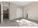 Bedroom featuring carpet, neutral walls, and multiple doorways at 2742 N Augustine --, Mesa, AZ 85207