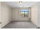 Bedroom featuring carpet, neutral walls, and a large window at 2742 N Augustine --, Mesa, AZ 85207