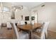Dining room showcasing high ceilings, carpeted floor, and a wood table and chairs in a neutral color palette at 2742 N Augustine --, Mesa, AZ 85207
