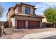 Charming two-story home with a tiled roof, stone accents, and a brick driveway with a two-car garage at 2742 N Augustine --, Mesa, AZ 85207