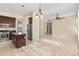 Bright kitchen featuring dark wood cabinets, granite countertops, an island, and stainless steel appliances at 2742 N Augustine --, Mesa, AZ 85207