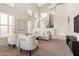 Bright and airy living room with a vaulted ceiling, large windows with plantation shutters, and neutral colored furnishings at 2742 N Augustine --, Mesa, AZ 85207