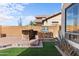 Backyard outdoor kitchen features a grill, and custom stone countertop at 2742 N Augustine --, Mesa, AZ 85207