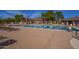 Outdoor lap swimming pool with lounge chairs, pool house and shade structures at 2742 N Augustine --, Mesa, AZ 85207