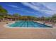 Outdoor lap swimming pool with lounge chairs and shade structures at 2742 N Augustine --, Mesa, AZ 85207