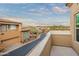 Balcony overlooking community, with views of homes and distant mountains at 28990 N White Feather Ln # 130, Scottsdale, AZ 85262