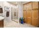 Bathroom with a walk-in shower, granite countertop and built-in cabinets at 28990 N White Feather Ln # 130, Scottsdale, AZ 85262