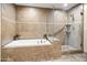 Bathroom with soaking tub and walk-in shower at 28990 N White Feather Ln # 130, Scottsdale, AZ 85262