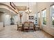 Bright dining area with a large glass-top table and chandelier at 28990 N White Feather Ln # 130, Scottsdale, AZ 85262