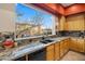 Kitchen with granite countertops and double sink at 28990 N White Feather Ln # 130, Scottsdale, AZ 85262