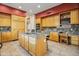 Modern kitchen with granite countertops and an island at 28990 N White Feather Ln # 130, Scottsdale, AZ 85262