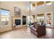 Relaxing living room with fireplace and large windows at 28990 N White Feather Ln # 130, Scottsdale, AZ 85262