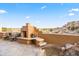 Outdoor patio with fireplace, seating area, and water feature at 28990 N White Feather Ln # 130, Scottsdale, AZ 85262