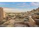 Scenic view of desert landscape, large boulders, and distant homes at 28990 N White Feather Ln # 130, Scottsdale, AZ 85262