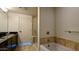 Bathroom featuring a soaking tub, separate shower, and stylish vanity at 310 S 4Th St # 2202, Phoenix, AZ 85004