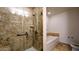 This luxurious bathroom has a glass shower, soaking tub, and stylish tilework at 310 S 4Th St # 2202, Phoenix, AZ 85004