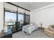 Bright bedroom with city views through large windows and comfortable furnishings at 310 S 4Th St # 2202, Phoenix, AZ 85004