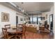 Bright living room with a dining table and a large window showcasing views of the cityscape at 310 S 4Th St # 2202, Phoenix, AZ 85004