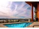 Rooftop pool with city views, surrounded by a secure fence and attractive landscaping at 310 S 4Th St # 2202, Phoenix, AZ 85004