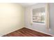 Bedroom with wood-look floors, large window, and neutral wall colors at 3104 E Broadway Rd # 9, Mesa, AZ 85204