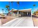 Mobile home exterior with carport and landscaping at 3104 E Broadway Rd # 9, Mesa, AZ 85204