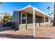 Side view of the mobile home with covered patio at 3104 E Broadway Rd # 9, Mesa, AZ 85204