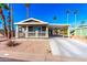 Single-story home with carport and desert landscaping at 3104 E Broadway Rd # 9, Mesa, AZ 85204