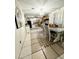 Kitchen and dining area with wood cabinets and tile floors at 3125 W Mclellan Blvd, Phoenix, AZ 85017