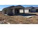 Newly built gray stucco home with attached garage and modern design on a construction site at 3205 W Sueno Dr, Eloy, AZ 85131