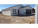 Charming home displays a stucco facade, dark trim and tiled roof, complemented by the new desert landscaping at 3215 W Sueno Dr, Eloy, AZ 85131