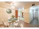 Dining area with a glass table and view to kitchen at 3249 W Maryland Ave, Phoenix, AZ 85017