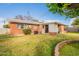 Brick rancher with covered patio, large backyard, and mature trees at 3249 W Maryland Ave, Phoenix, AZ 85017