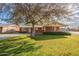 Brick ranch house with covered porch and mature landscaping at 3249 W Maryland Ave, Phoenix, AZ 85017