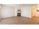 Living room with fireplace and wood flooring at 3249 W Maryland Ave, Phoenix, AZ 85017