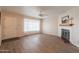 Living room with fireplace and entryway at 3249 W Maryland Ave, Phoenix, AZ 85017