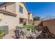 Spacious backyard with artificial turf, firepit, and desert landscaping at 3451 E Tyson St, Gilbert, AZ 85295