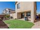 Large backyard featuring artificial turf, a patio, and a fire pit area at 3451 E Tyson St, Gilbert, AZ 85295