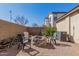 Cozy backyard setting with a fire pit, chairs and desert landscaping at 3451 E Tyson St, Gilbert, AZ 85295