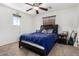 Bedroom features carpet flooring, ceiling fan, a queen bed, and a window with blinds at 3451 E Tyson St, Gilbert, AZ 85295