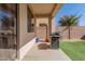 Relaxing covered patio with a built-in barbecue and artificial turf at 3451 E Tyson St, Gilbert, AZ 85295