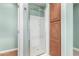 Clean bathroom with a shower and storage cabinet at 3554 N Hooper St, Buckeye, AZ 85396