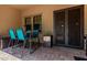 Small patio with table and chairs next to the door at 3554 N Hooper St, Buckeye, AZ 85396