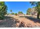 Spacious backyard, partial view of house and pool at 4027 E Pueblo Ave, Mesa, AZ 85206